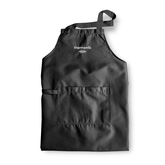 Black apron with front pocket and Thermomix logo and Vorwerk branding on chest
